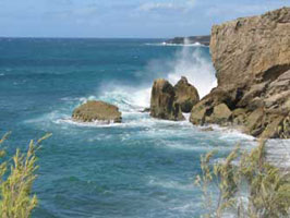 A view of the surf at the edge of Poipu Beach, Kauai The surf